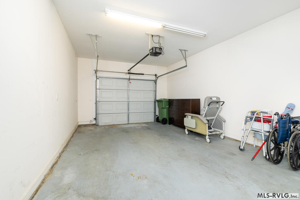 Attached Garage - Dresser pictured does NOT convey - 128 Savannah Circle, Roanoke Rapids NC 27870
