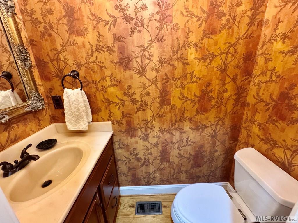 Half Bath off the Family Room - 454 Grace Stone Drive, Clarksville VA 23927