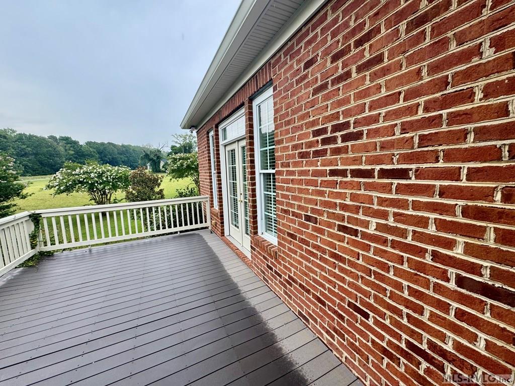 The Private Deck off the Primary Suite - 454 Grace Stone Drive, Clarksville VA 23927