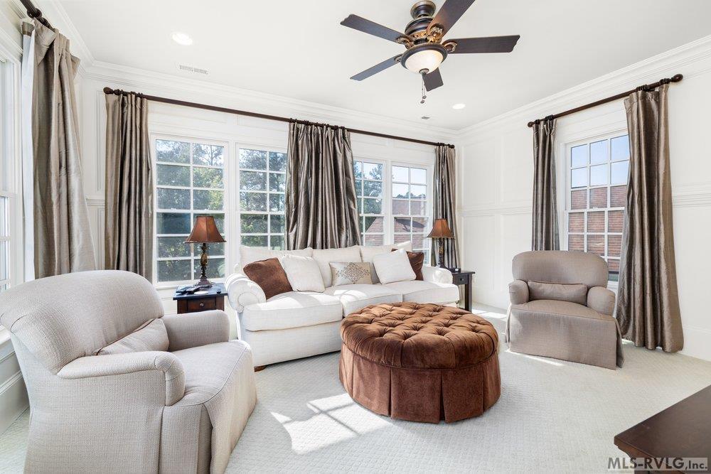 Sun-Drenched Living Area, Step into this bright and airy living space, where expansive windows flood the room with natural light. - 381 West Bend Dr., Gasburg VA 23857