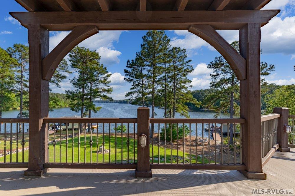 Frame It, This heavy-timber pergola and dark wood railings create a stylish, sturdy frame that perfectly complements your lake view. - 381 West Bend Dr., Gasburg VA 23857