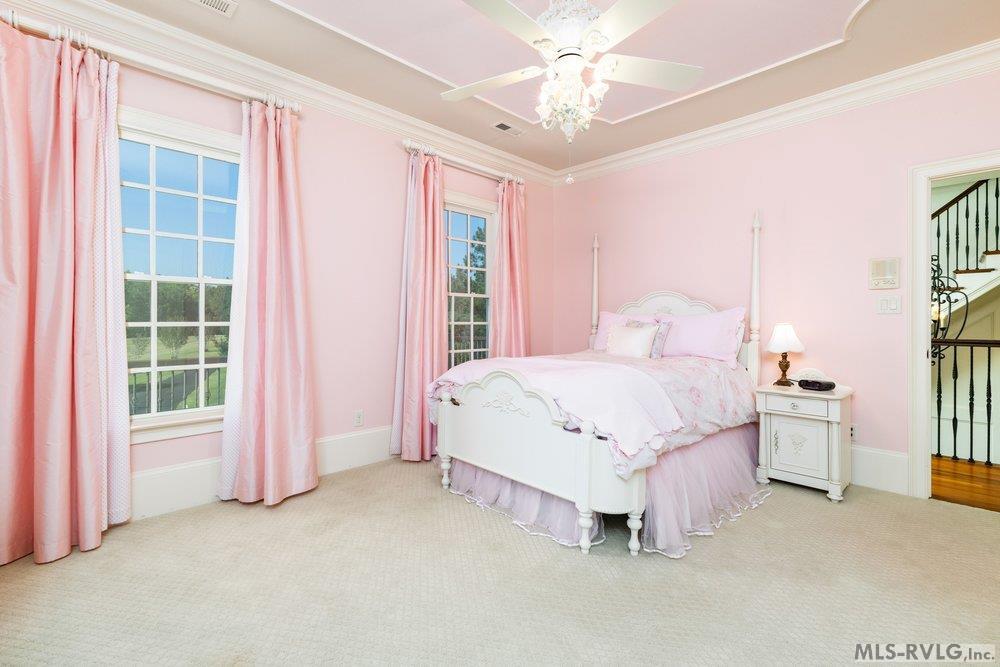 Cloud of Cotton Candy, This style, defined by hyper-feminine, vintage-inspired elements, is a major trend right now. This room captures the aesthetic perfectly with its soft palette and timeless furniture. - 381 West Bend Dr., Gasburg VA 23857