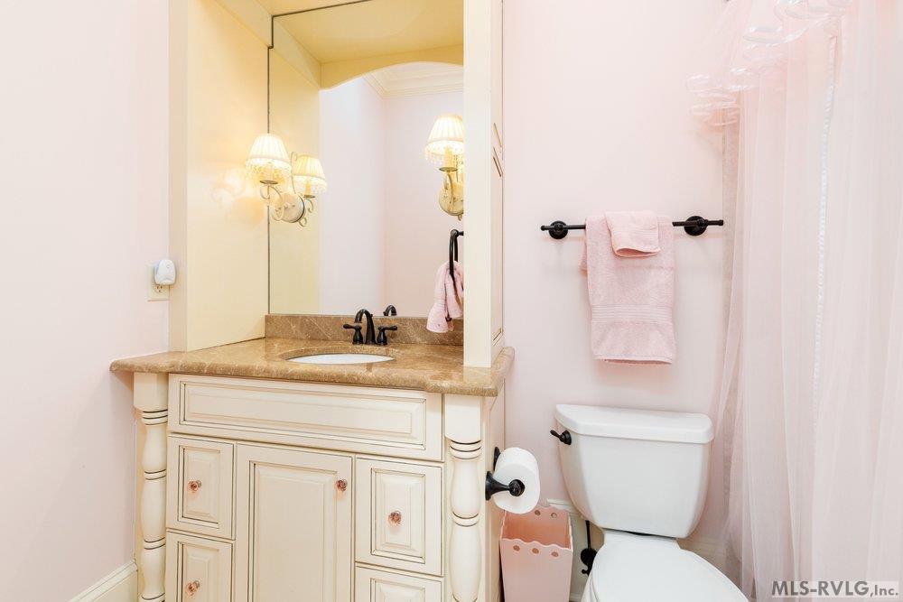 Charming Vintage-Style Bathroom, Perfect spot for a little 'me time' before heading back out to the lake. - 381 West Bend Dr., Gasburg VA 23857