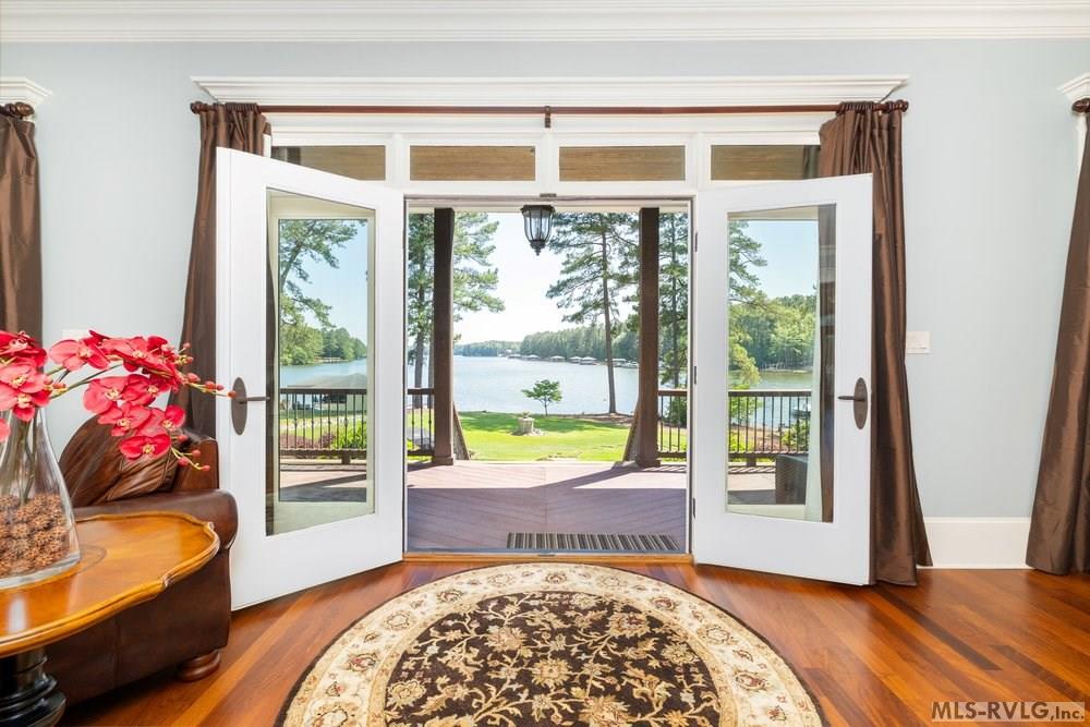 Doorway to Lake Gaston , Seamlessly blend indoor and outdoor living with elegant French doors that open from the living room to reveal a breathtaking, unobstructed view of Lake Gaston—the perfect backdrop for morning coffee o - 381 West Bend Dr., Gasburg VA 23857