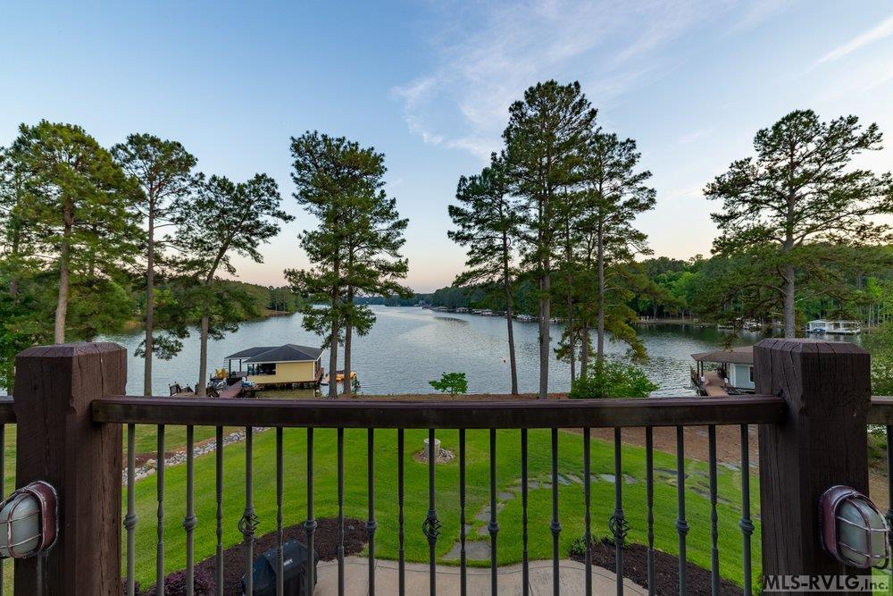 Classic Charm Meets Waterfront Elegance, Large, multi-level balconies and a private dock for sunset views. - 381 West Bend Dr., Gasburg VA 23857