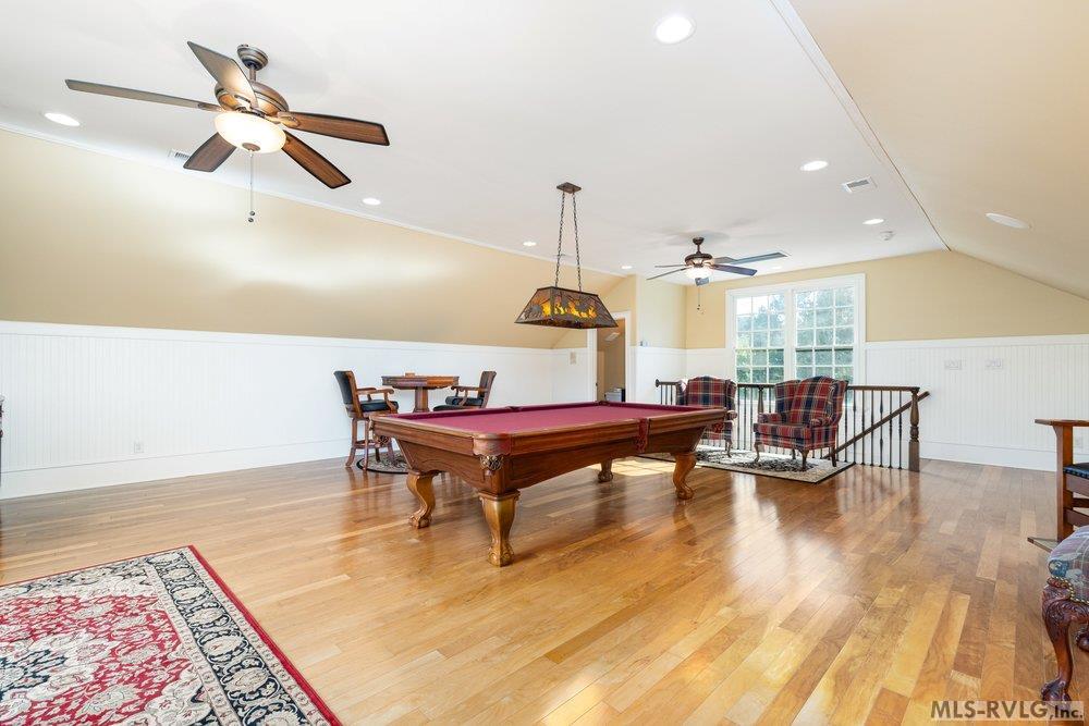 Entertainer's Dream Room, Billiards, cards, or a good cigar—this room radiates relaxation with its ample space, beautiful floors, and abundance of natural light. - 381 West Bend Dr., Gasburg VA 23857