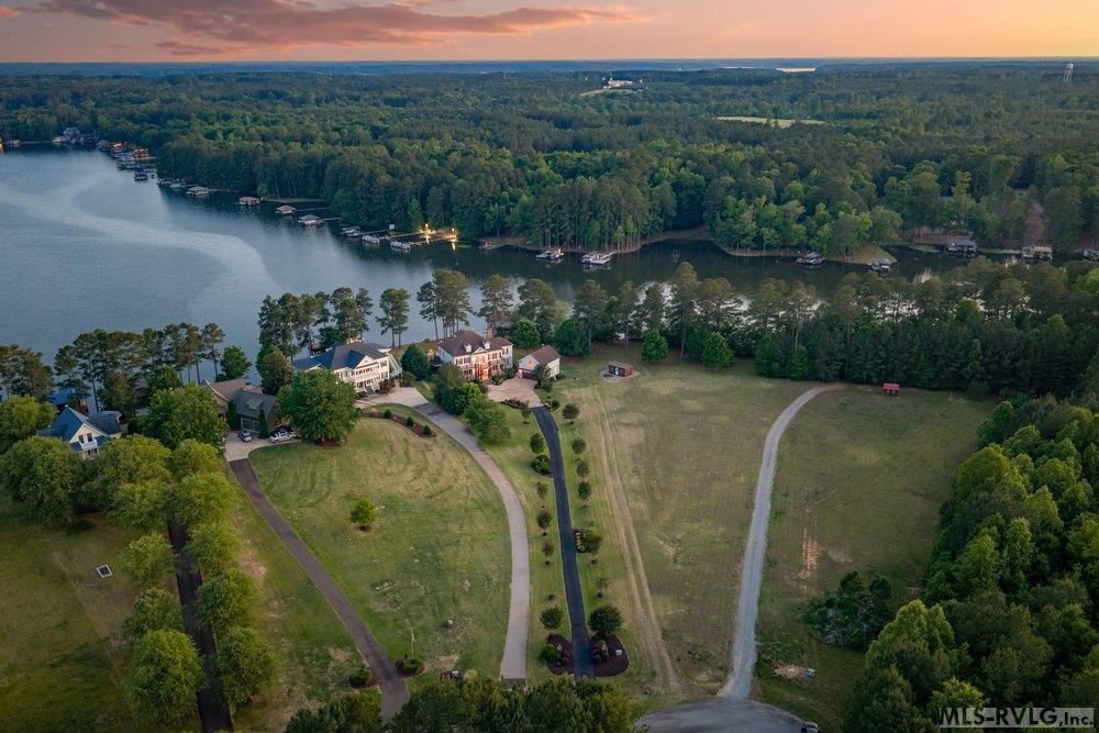 Sprawling Estate, Where land meets the serene waters of a tranquil cove. A sanctuary designed for those who value privacy and a deep connection to nature. - 381 West Bend Dr., Gasburg VA 23857