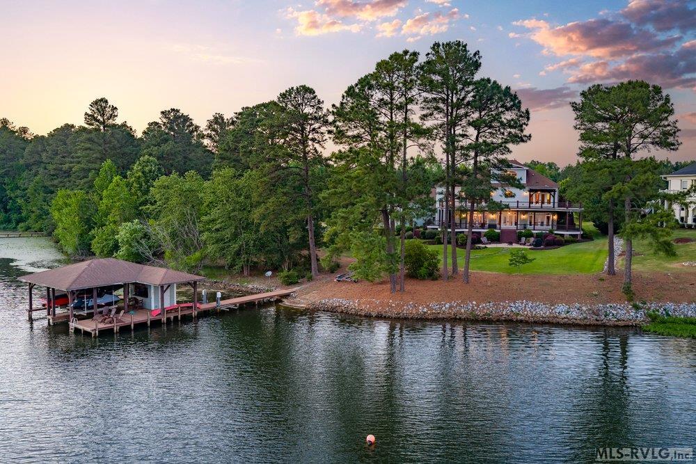 Golden Hour Getaway, Imagine launching your kayak at dawn or toasting the sunset from your private boathouse. Here, life is measured in ripples and reflections, not minutes. - 381 West Bend Dr., Gasburg VA 23857
