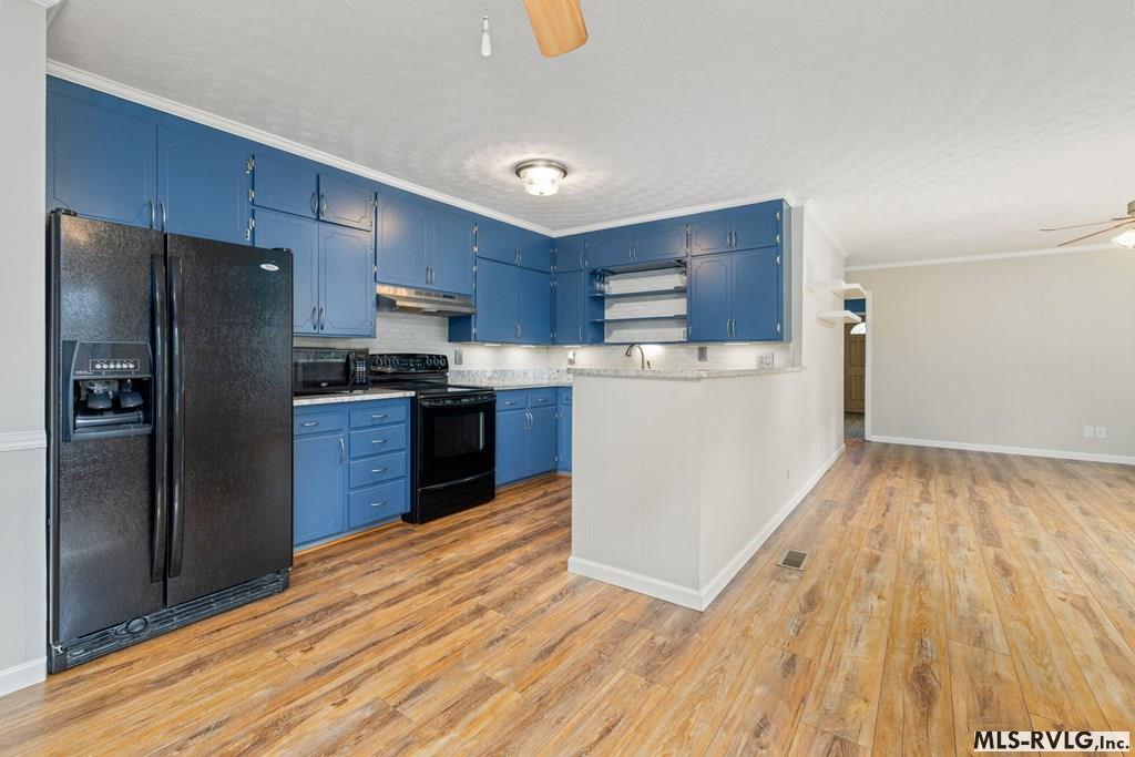 Appliances to convey, The black stove and refrigerator will convey with the home instead of the stainless appliances currently present. - 1103 E. 7th St, Roanoke Rapids NC 27870